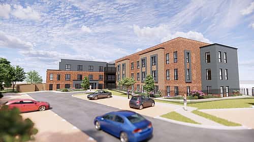 A modern, multi-story brick building with a mix of parking spaces and landscaping.