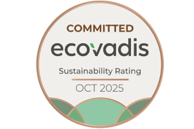 This is the ecovadis logo. The logo in a circle shaped badge and announces we are committed to ecovardis as of october 2025. The colours on the badge are gold, beige and green.