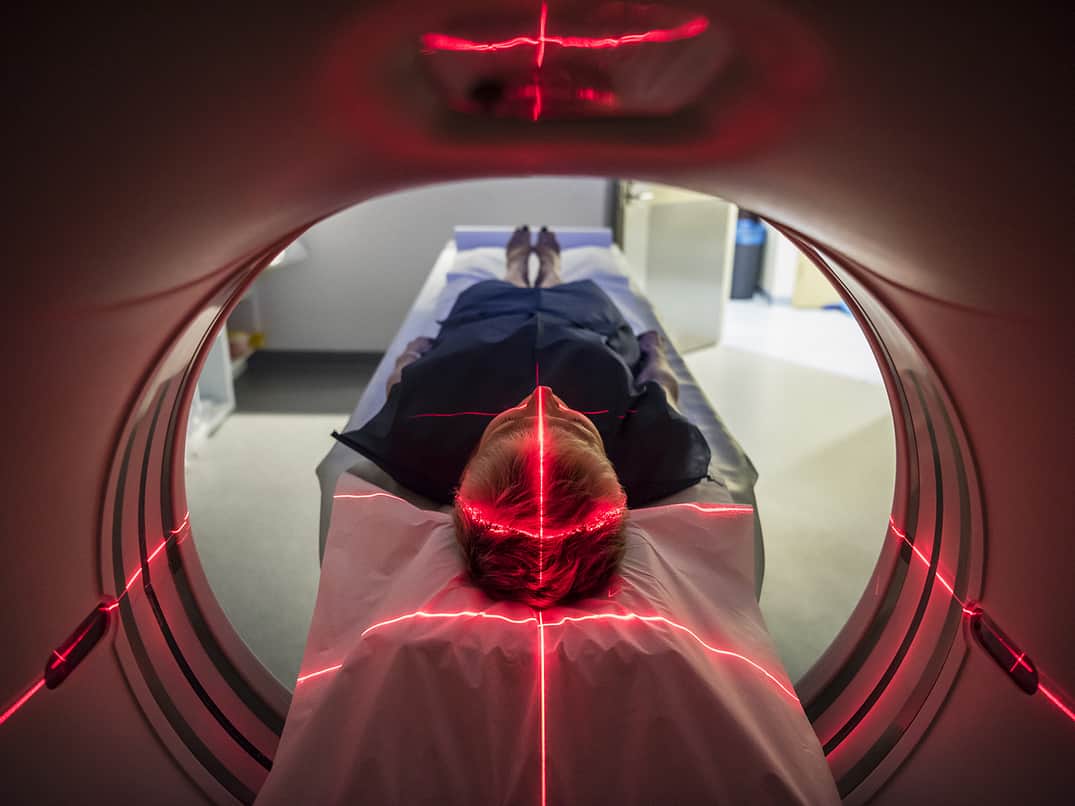 Man in PET scanner