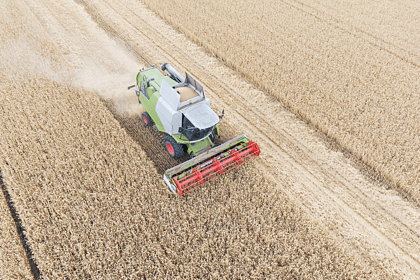 Combine Haverster Ploughing Fields
