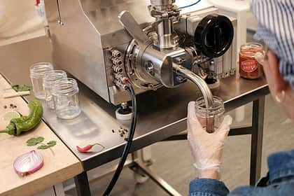 Person Filling Chilli Jam