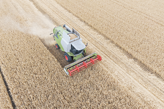 Combine Haverster Ploughing Fields