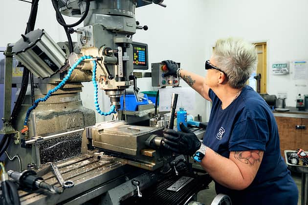 Adelphi 1250 person setting up drilling machine