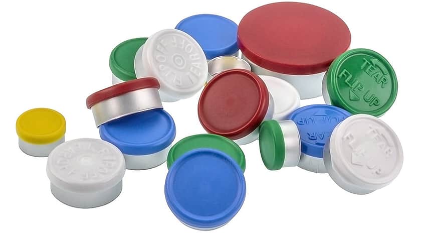 A selection of coloured crimp seals with plastic disks.