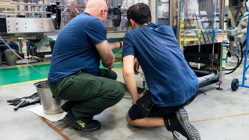 Two people working on the MFIL shop floor