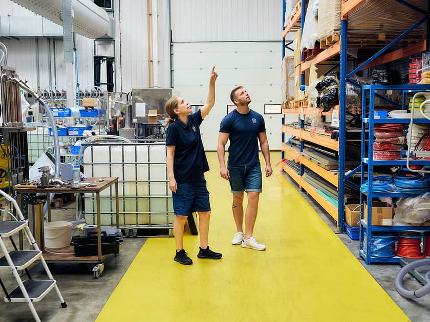 Adelphi 0564 Two people walking shop floor