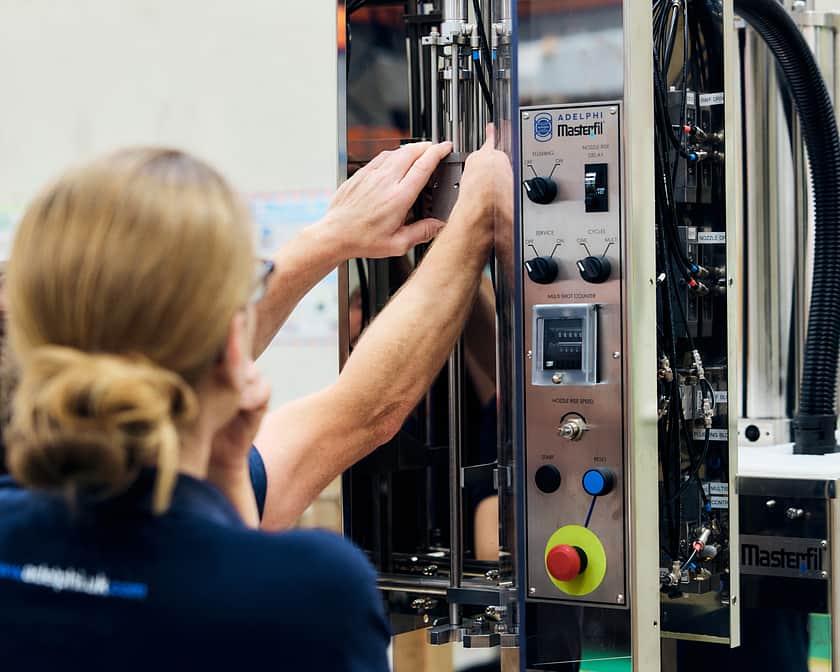 Adelphi 1235 Masterfil Two People Working At Machine