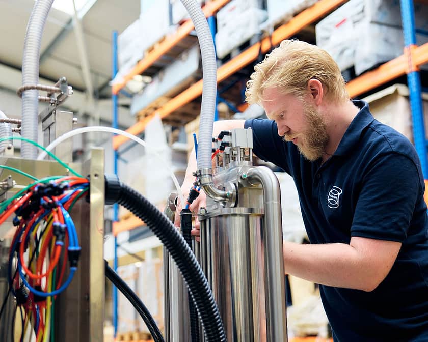 Adelphi 0690 Someone Working On Semi Automatic Volumetric Filling Machine