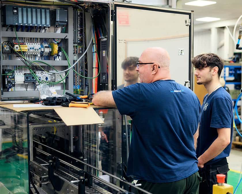 Adelphi 0584 Two people working on a filler