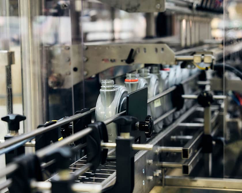 Adelphi 0500 Bottles Coming Off the Conveyor Line