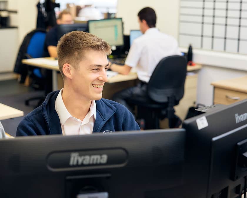 Adelphi 0404 Simily Team Member woking on Screens