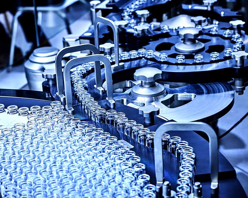 Vials on conveyor belt