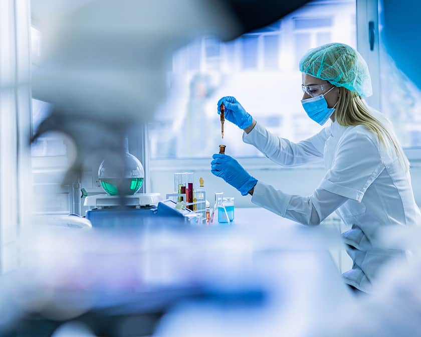 Lab worker with sample