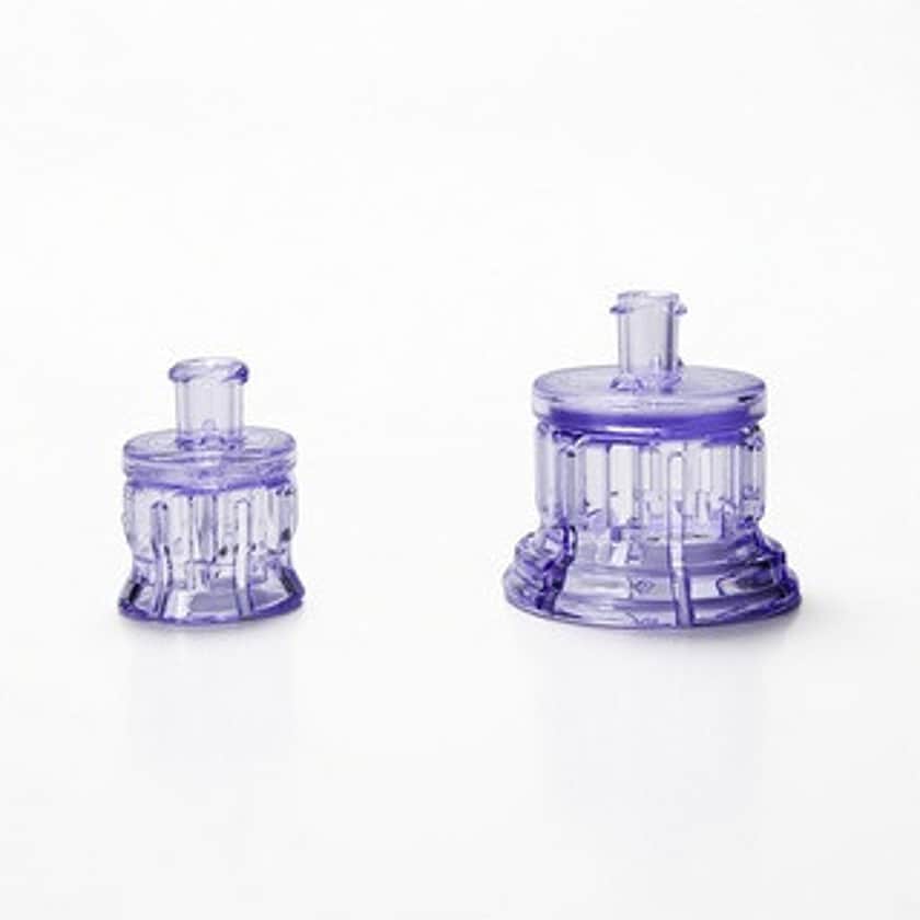 A 13mm and a 20mm Sterile Vented Vial Adapter side by side.