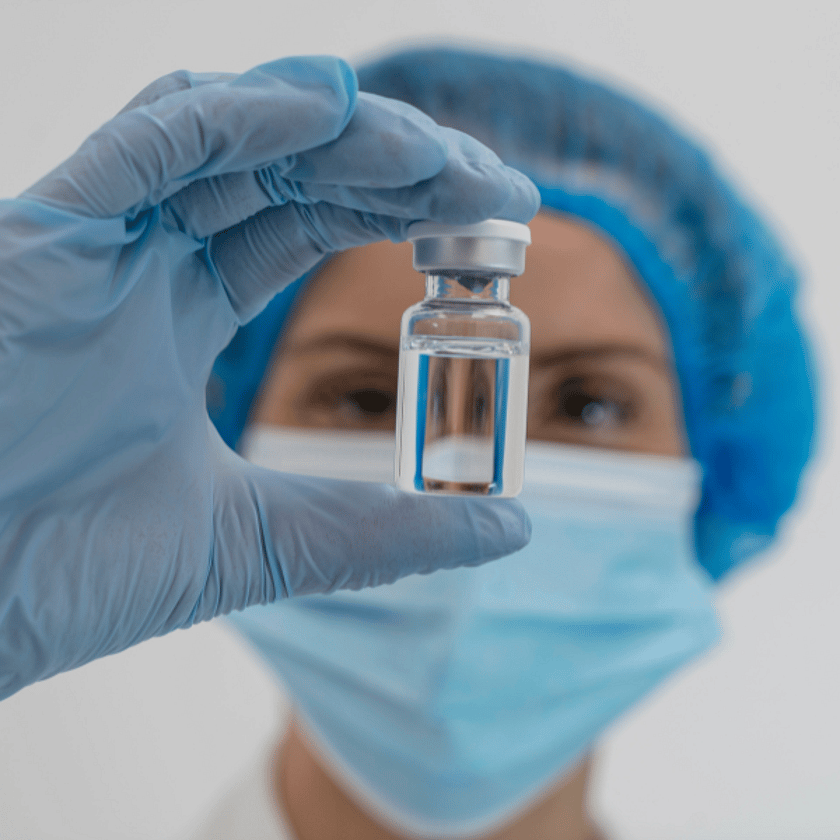 Person Holding Vial Looking Into It 600 x 600