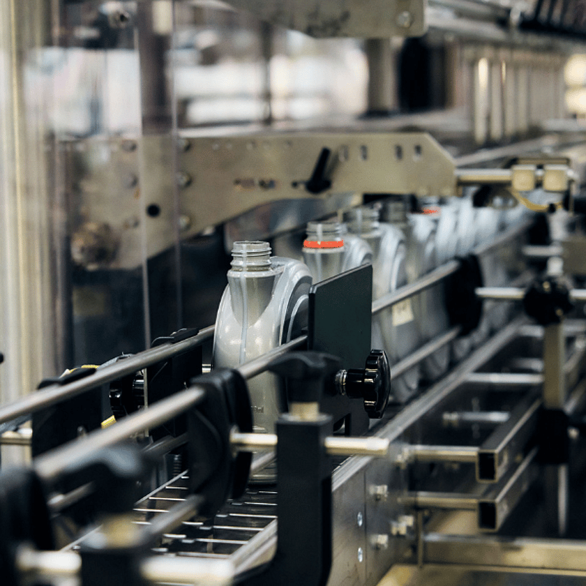Bottles Coming Off the Conveyor Line 600 x 600