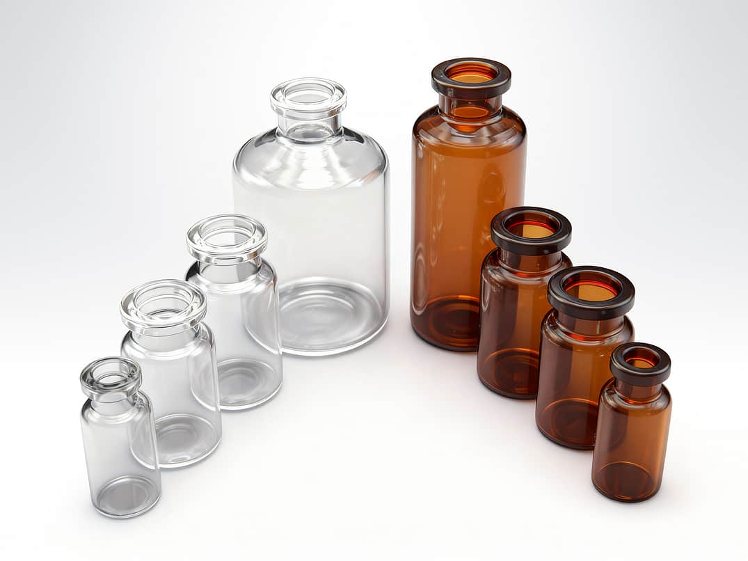 A selection of clear and amber glass vials.