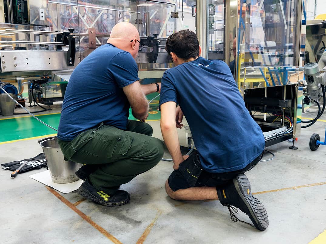 Two people working on the MFIL shop floor