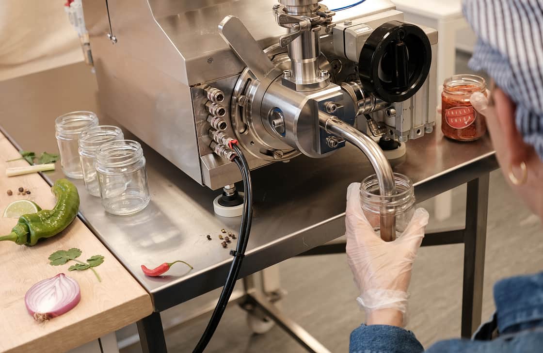 Person Filling Chilli Jam
