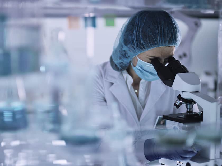 Microscope with full lab suit right